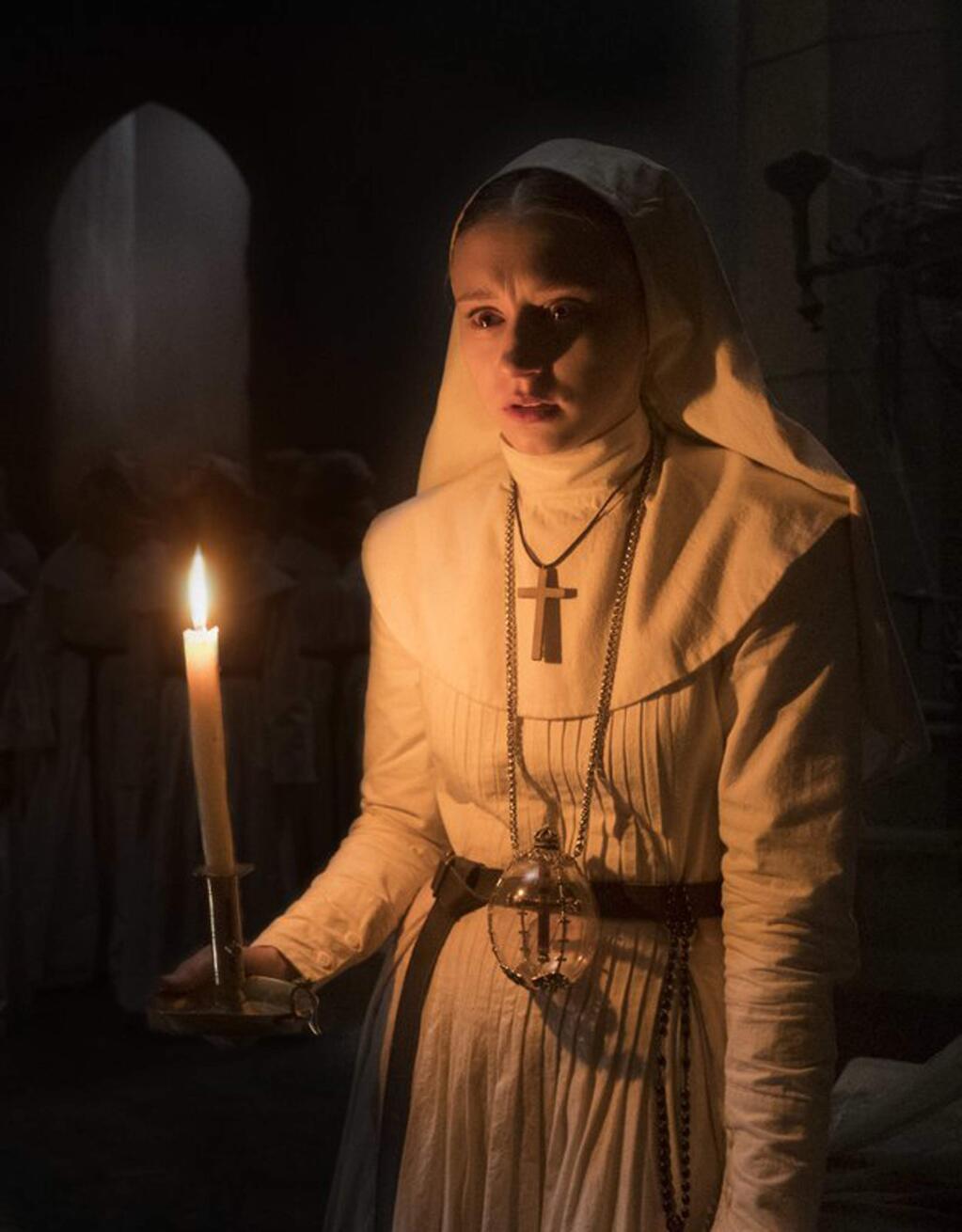 Taissa Farmiga, whose sister Vera starred in 'The Conjuring,' plays Irene, a novitiate sent by the Vatican to help investigate the suicide of a young nun at a cloistered abbey in 'The Nun.' (Dustin Lubin/Warner Bros.)