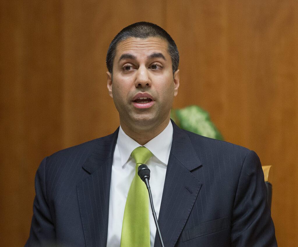 FILE - In this Feb. 26, 2015, file photo, Federal Communication Commission Commissioner Ajit Pai speaks during an open hearing and vote on 'Net Neutrality' in Washington. (AP Photo/Pablo Martinez Monsivais, File)