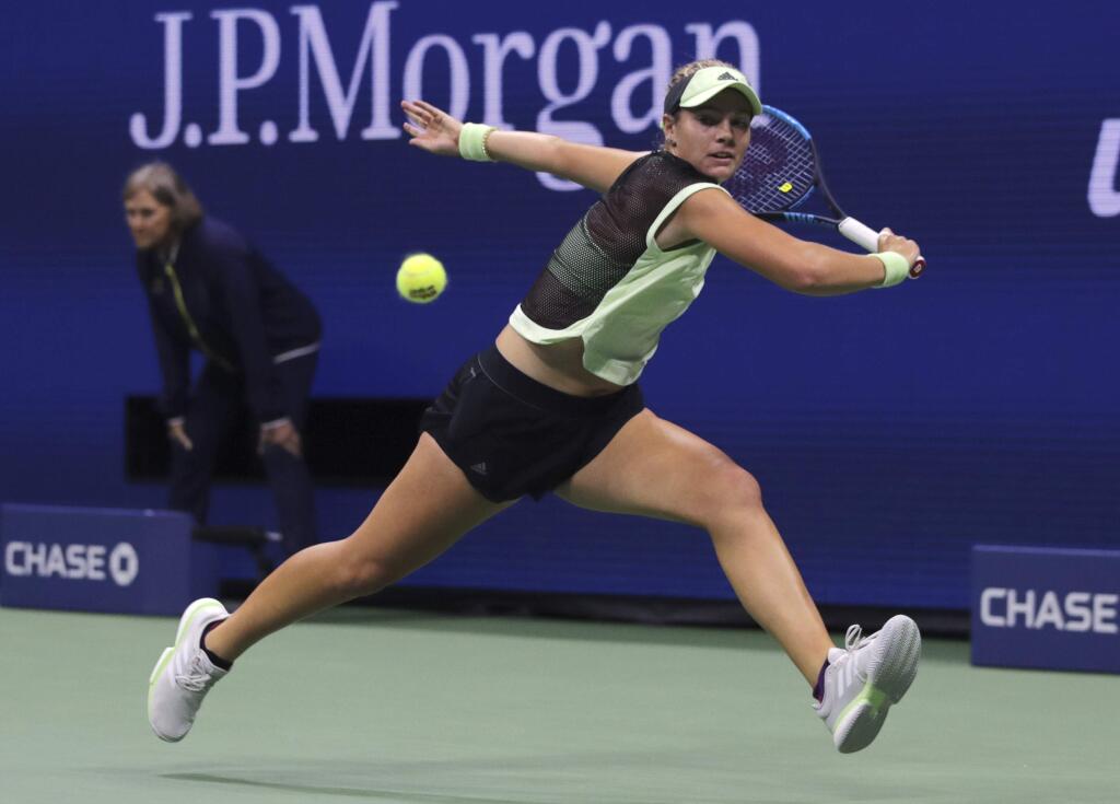 Caty McNally, of the United States, chases the ball on a shot from Serena Williams, of the United States, during the second round of the U.S. Open tennis tournament in New York, Wednesday, Aug. 28, 2019. (AP Photo/Charles Krupa)