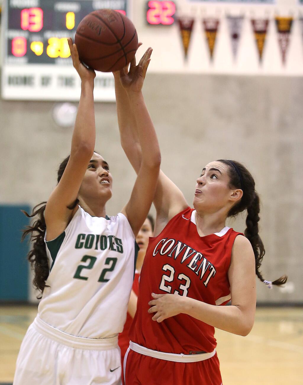 Sonoma Academy's Clara Spars goes up for a shot as Convent of Sacred Heart's Ariana Abdulmassih defends during the game held at Sonoma Academy, Wednesday, February 25, 2015. (CRISTA JEREMIASON / The Press Democrat)