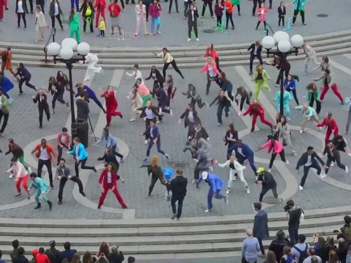 More than 200 dancers, many of them men, suited up in pantsuits in honor of Hillary Clinton and broke out in dance. Oct. 2, 2016. (Youtube / Pantsuit Nation)