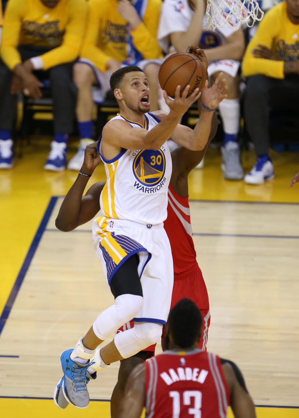 Golden State Warriors guard Stephen Curry makes a layup against the Houston Rockets, during their game in Oakland on Saturday, April 16, 2016. The Warriors defeated the Rockets 104-78.(Christopher Chung/ The Press Democrat)