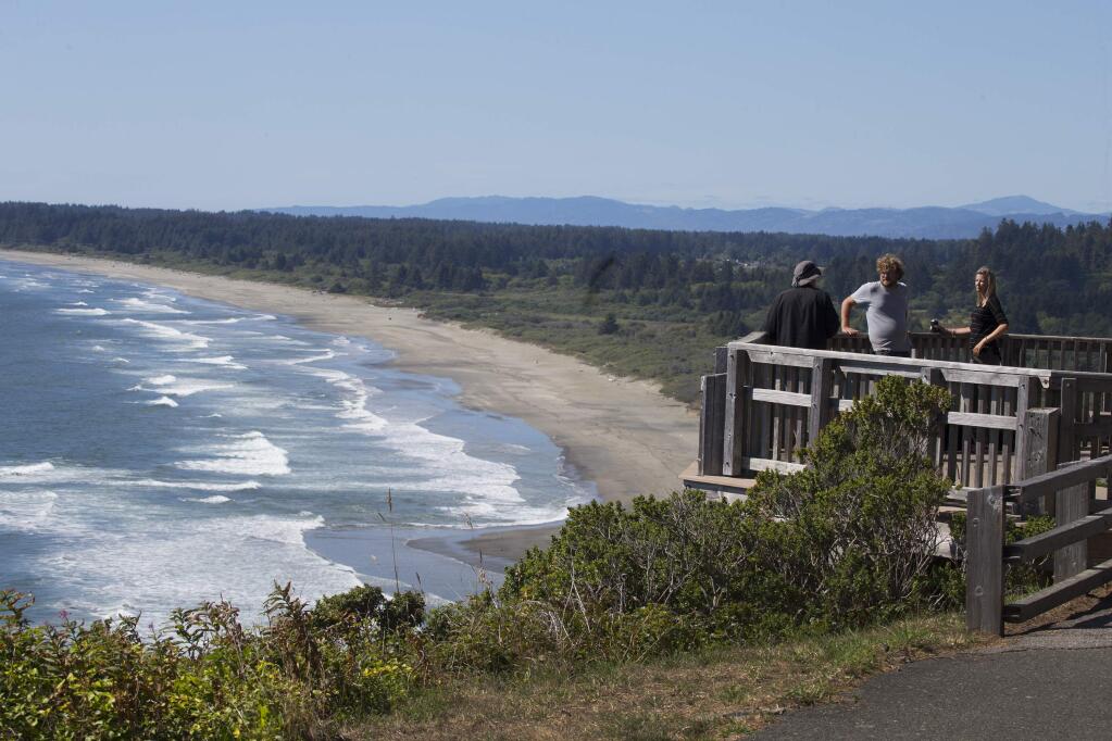 People take in the scenic view overlooking Crescent City. (ALLEN J. SCHABEN / Los Angeles Times)