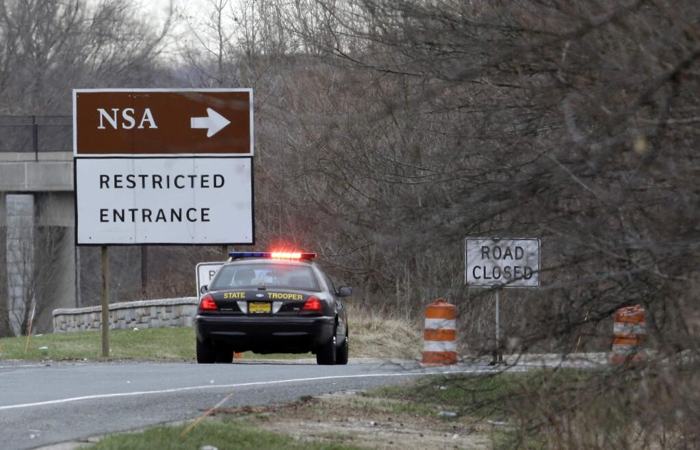 A Maryland State Police cruiser sits at a blocked southbound entrance on the Baltimore-Washington Parkway that accesses the National Security Agency, Monday, March 30, 2015, in Fort Meade, Md. (AP Photo/Patrick Semansky)