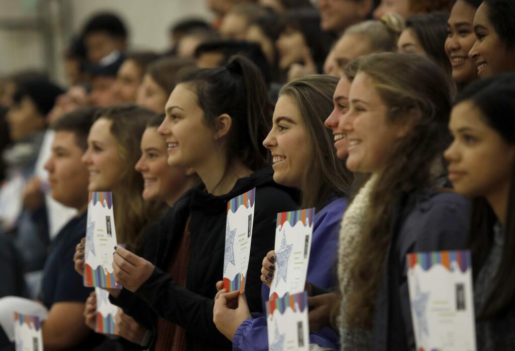 Petaluma High School students who volunteered at emergency shelters following the wildfires pose for a group photo with their certificates for Trojan of the Month at Petaluma High School on Wednesday, November 15, 2017 in Petaluma, California . (BETH SCHLANKER/The Press Democrat)