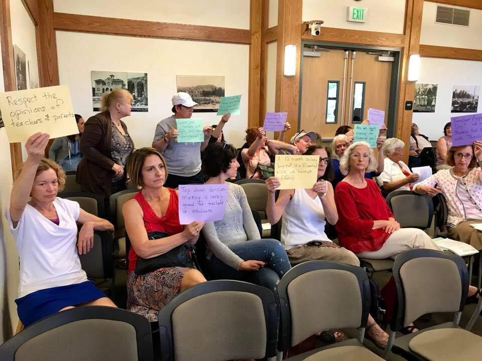 Attendees of the Sonoma Valley Unified School Districts May 8 meeting came bearing signs opposing the proposed contract offer to embattled superintendent candidate Socorro Shiels.