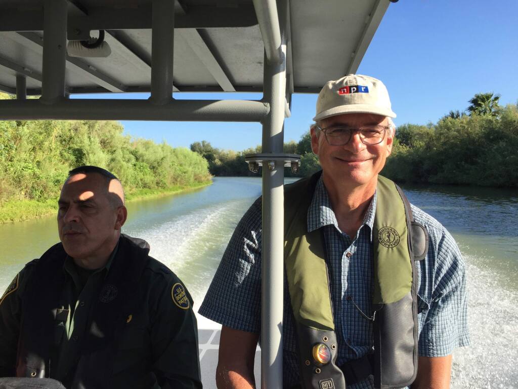 National Public Radio's immigration correspondent John Burnett, traveling with the Border Patrol on the Rio Grande near McAllen, Texas, last fall. Burnett will be featured in the June 12 Sonoma Speakers Series event in Sonoma. in conversation with Sonoma Police Chief Bret Sackett. (Peter Breslow/NPR)