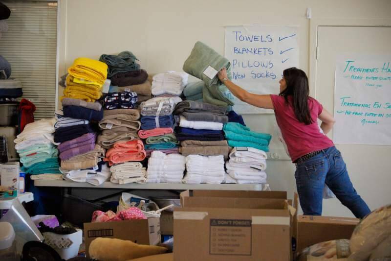 Volunteers in Petaluma help organize the donations they received for the evacuees of the Kincade fire. (CRISSY PASCUAL/ARGUS-COURIER STAFF)