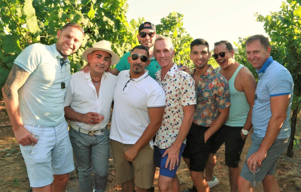 From left to right, Reynard Hiole, Rafael Lucatero, Ventura Amezquita, Bill Smith, Leo Renteria, Micah Majarian, Thomas Lecoca and Bradley enjoy the vineyards at the Gay Wine Weekend festivities at Chateau St. Jean Winery in Kenwood Saturday, July 21, 2018. (WILL BUCQUOY/ FOR THE PD)
