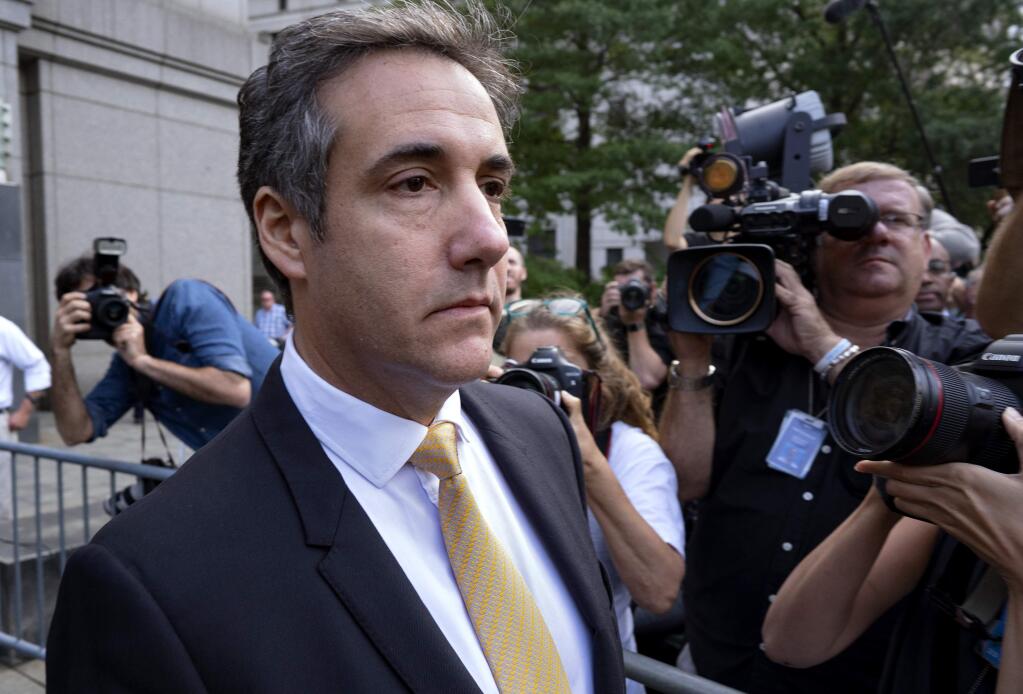 FILE - In this Aug. 21, 2018 file photo, Michael Cohen, former personal lawyer to President Donald Trump, leaves federal court after reaching a plea agreement in New York. On Thursday, Sept. 20, 2018, via Twitter, Cohen praised himself for providing “critical information” in the special counsel's investigation into Russian interference in the 2016 election. (AP Photo/Craig Ruttle, File)