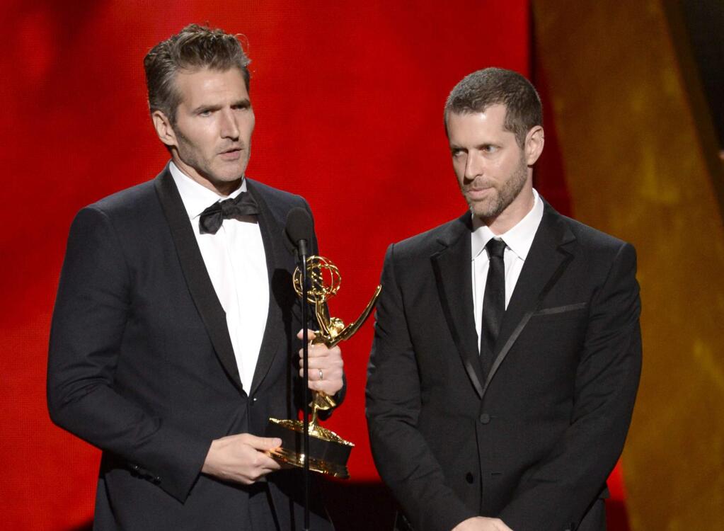 FILE - In this Sept. 20, 2015 file photo, David Benioff, left, and D.B. Weiss accept the award for outstanding writing for a drama series for 'Game Of Thrones' at the 67th Primetime Emmy Awards in Los Angeles. Benioff and Weiss are writing and producing a new series of Star Wars films for Lucasfilm. The Walt Disney Studios said Tuesday that the films will be separate from both the Skywalker saga and the new trilogy being planned by “The Last Jedi” director Rian Johnson. (Photo by Phil McCarten/Invision/AP, File)