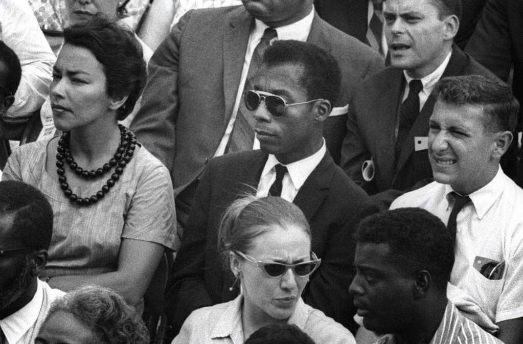 The unfinished book, “Remember This House,” by famed novelist, poet and social critic James Baldwin, center, is at the center of Raoul Peck's film, “I Am Not Your Negro.” (Magnolia Pictures)