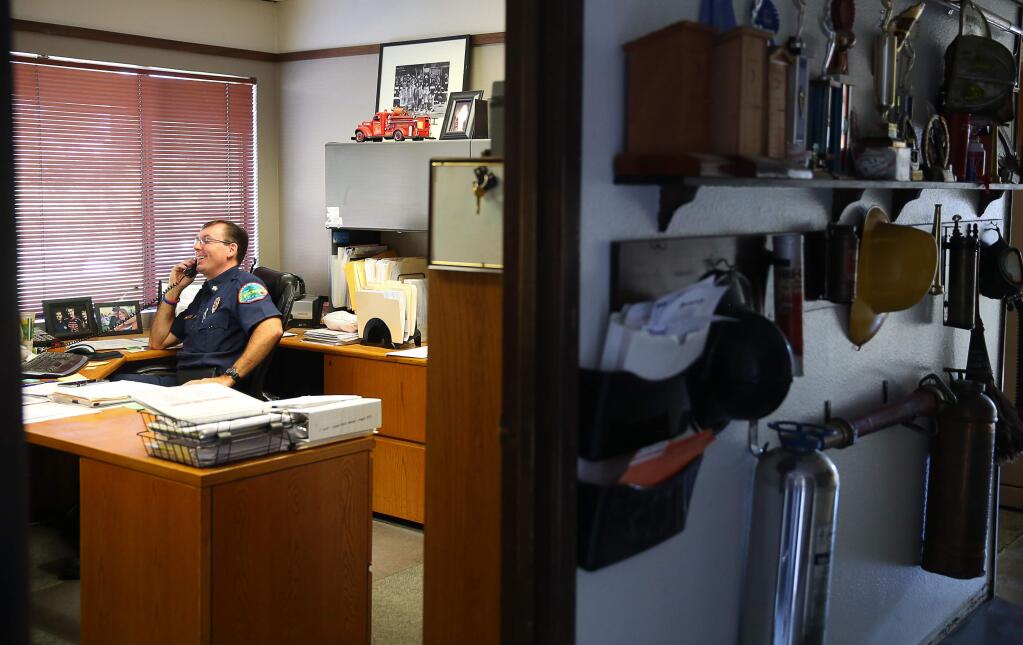 Forestville Fire Protection District, and Russian River Fire Protection District, Fire Chief Max Ming works in his office at the Forestville fire station on Monday, October 19, 2015. (Christopher Chung / The Press Democrat)