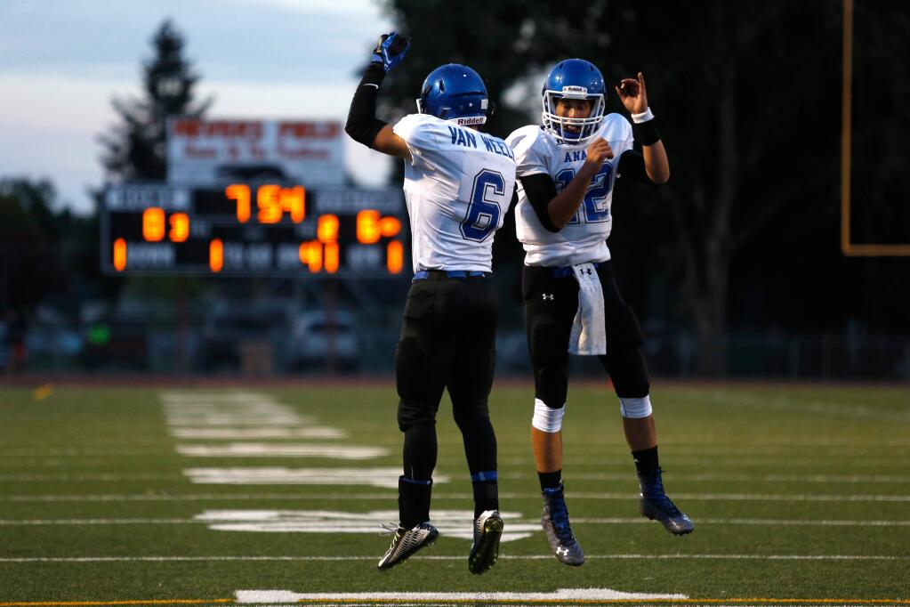 Analy's Schuyler Van Weele (6) celebrates his touchdown with quarterback Jack Newman(12) during a varsity football game between Analy and Casa Grande high schools in Santa Rosa, California, on August 28, 2015. (Alvin Jornada / The Press Democrat)