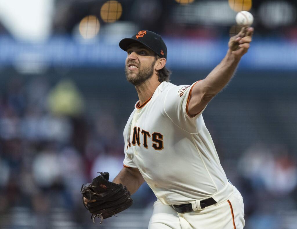 FILE - In this Sept. 9,2019, file photo, San Francisco Giants starting pitcher Madison Bumgarner throws against a Pittsburgh Pirates' batter in the second inning of a baseball game in San Francisco. Bumgarner has received a $17.8 million qualifying offer from the Giants, a move that likely will decrease demand for him in the free-agent market. (AP Photo/John Hefti, File)