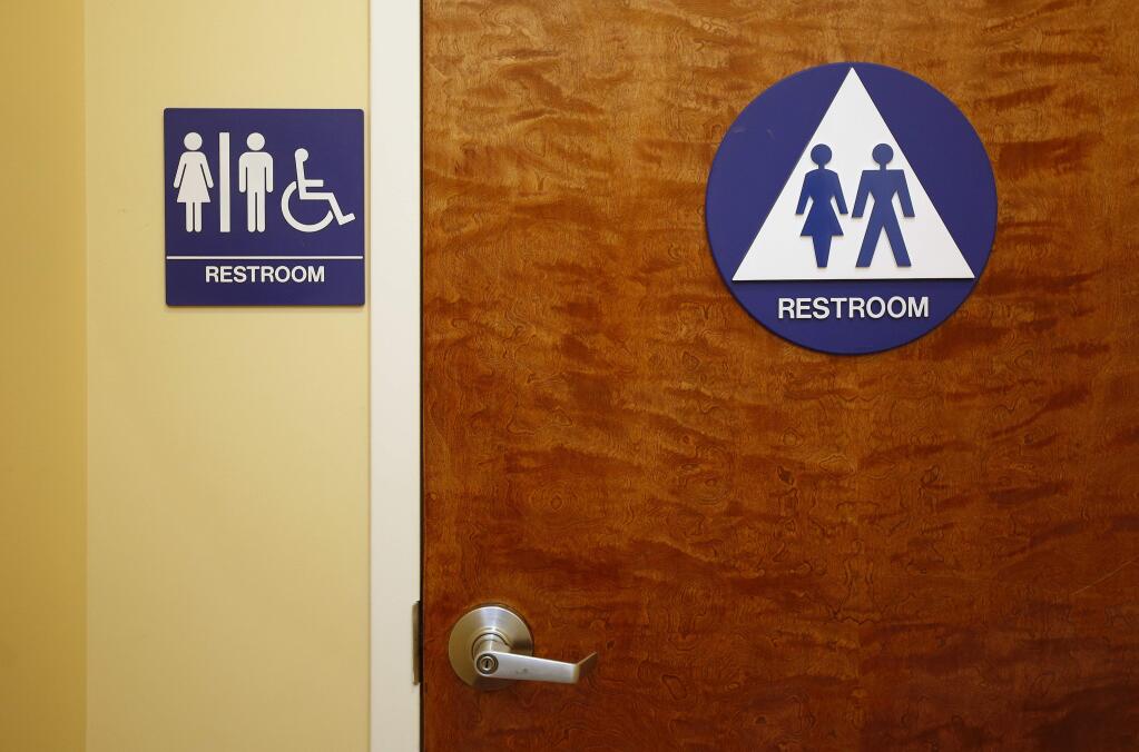 A gender neutral restroom is seen at the Downtown & Vine Restaurant and Wine Bar Monday, May 9, 2016, in Sacramento, Calif. (AP Photo/Rich Pedroncelli)