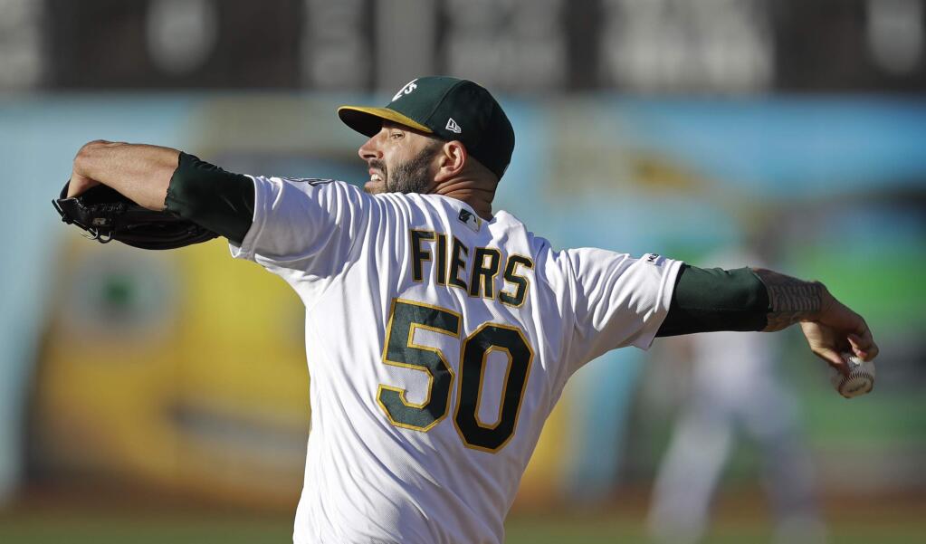 Oakland Athletics pitcher Mike Fiers works against the St. Louis Cardinals in the first inning Saturday, Aug. 3, 2019, in Oakland. (AP Photo/Ben Margot)