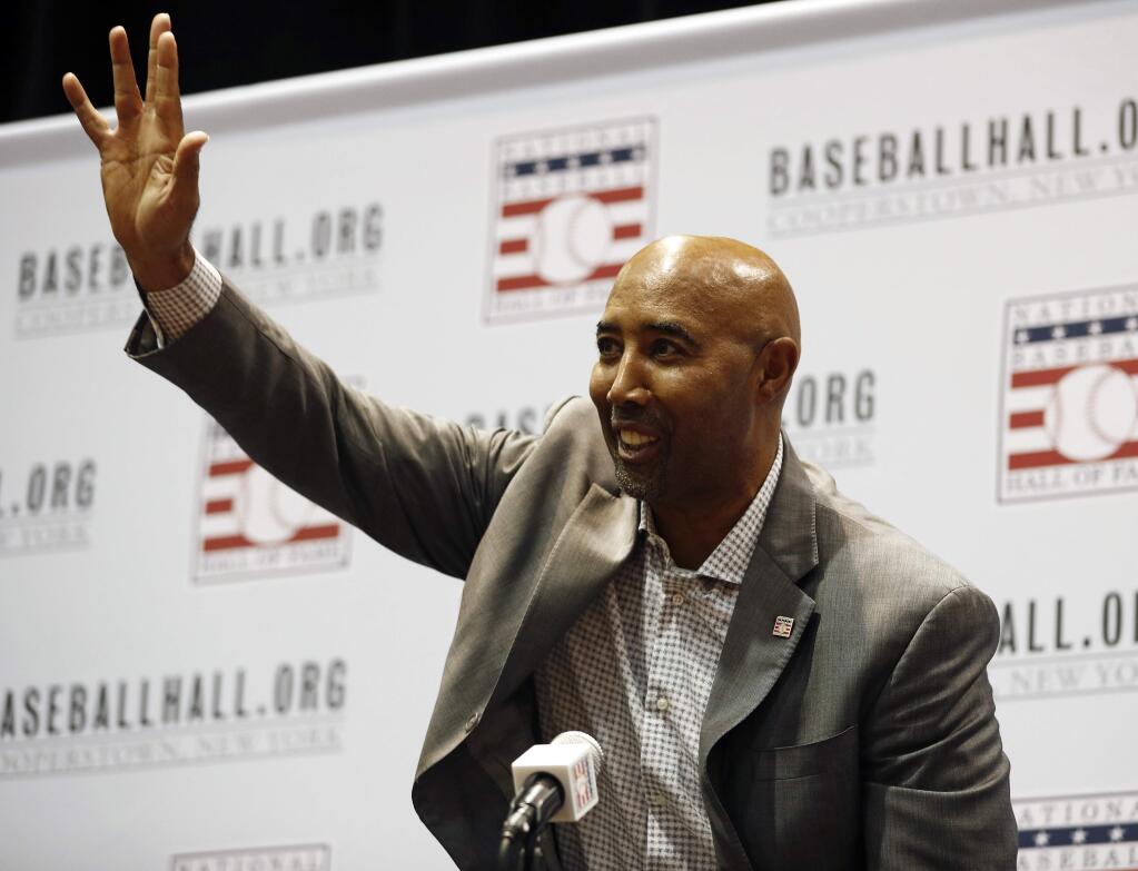 Harold Baines waves during a news conference for the baseball Hall of Fame during the Major League Baseball winter meetings, Monday, Dec. 10, 2018, in Las Vegas. (AP Photo/John Locher)