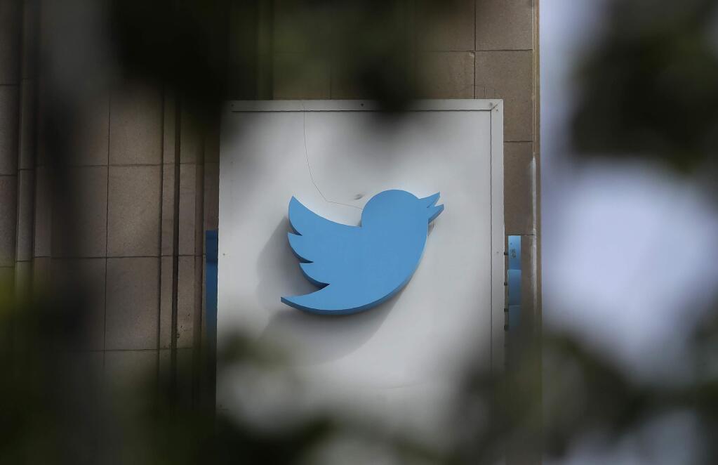 FILE - This July 9, 2019, file photo shows a sign outside of the Twitter office building in San Francisco. (AP Photo/Jeff Chiu, File)