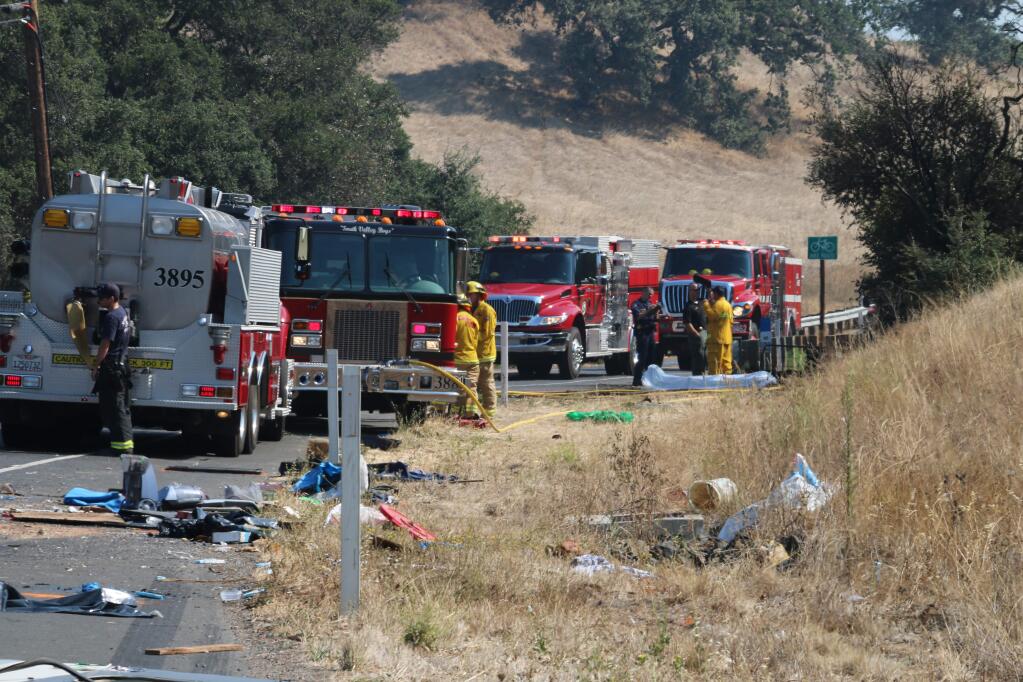 A motor home that caught fire on Stage Gulch Road south of Petaluma, killing its driver, left a trail of debris in the roadway on Sunday, Aug.16, 2015. (ANGELA HART/ PD)