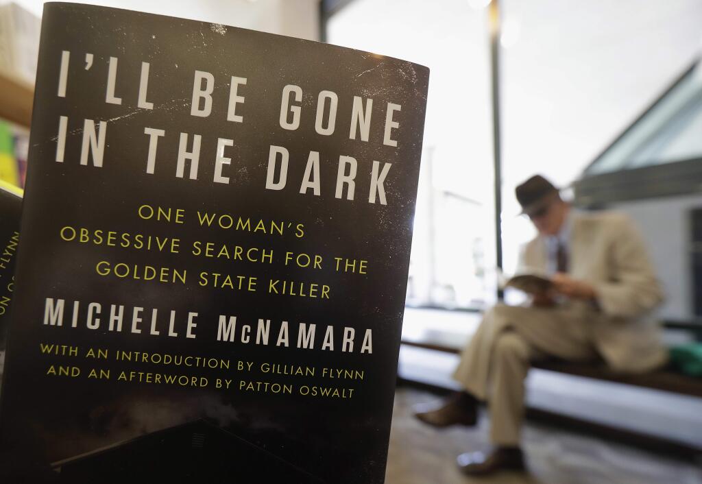 This Wednesday, April 25, 2018 photo shows a copy of the book 'I'll Be Gone in the Dark: One Woman's Obsessive Search for the Golden State Killer' by Michelle McNamara at a Books Inc. bookstore in San Francisco. California authorities say a man they suspect of being a serial killer tied to dozens of slayings and sexual assaults in the 1970s and '80s has been charged with murder. (AP Photo/Jeff Chiu)