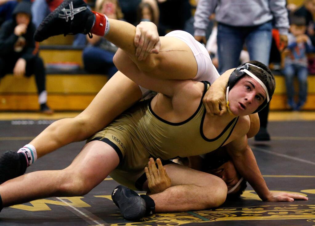 Windsor's Dominic DuCharme, right, lifts American Canyon's Jimmy Hoang during the 170-lbs. final match at the King of the Mat wrestling tournament in Windsor on Saturday, Jan. 23, 2016. (Alvin Jornada / The Press Democrat)