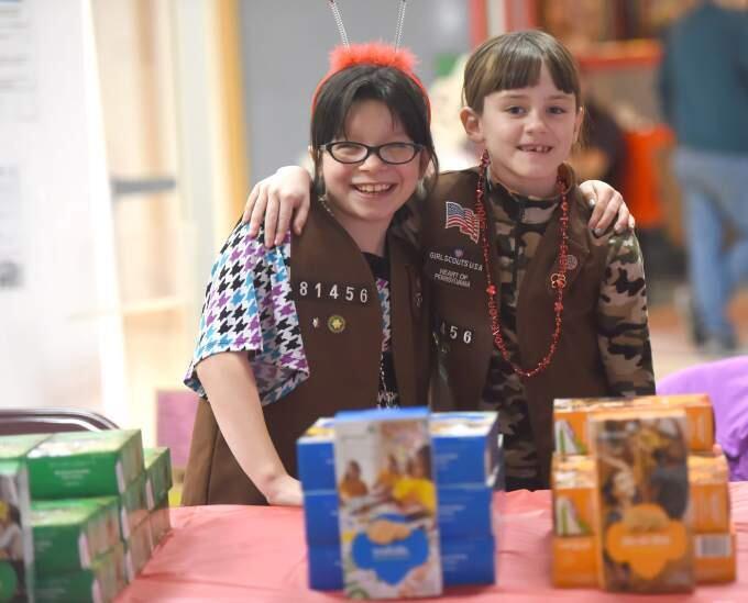 Emily Niner, 8, left, and Amanda Kane, 8, of Brownie troop 81456 sell Girl Scout Cookies at Chambersburg Mall in Chambersburg, Pa. on Saturday, Feb. 14, 2015. (AP Photo/Public Opinion, Ryan Blackwell)