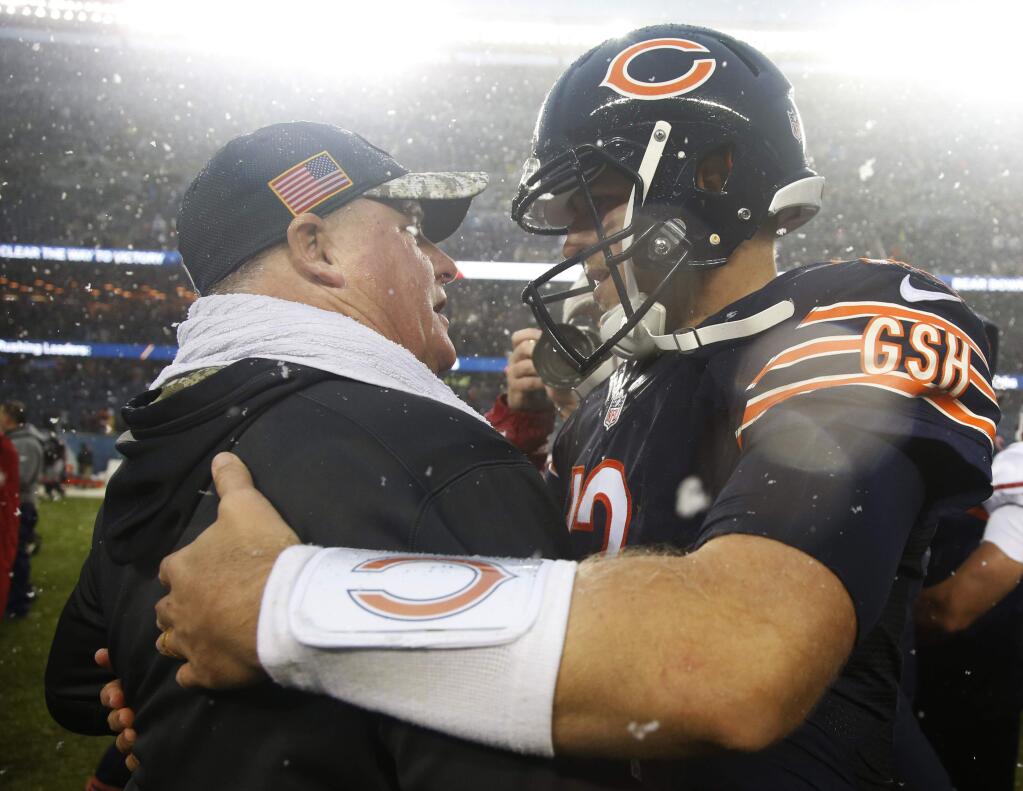 San Francisco 49ers head coach Chip Kelly, left, talks to Chicago Bears quarterback Matt Barkley (12) after their NFL football game, Sunday, Dec. 4, 2016, in Chicago. The Bears won 26-6. (AP Photo/Nam Y. Huh)