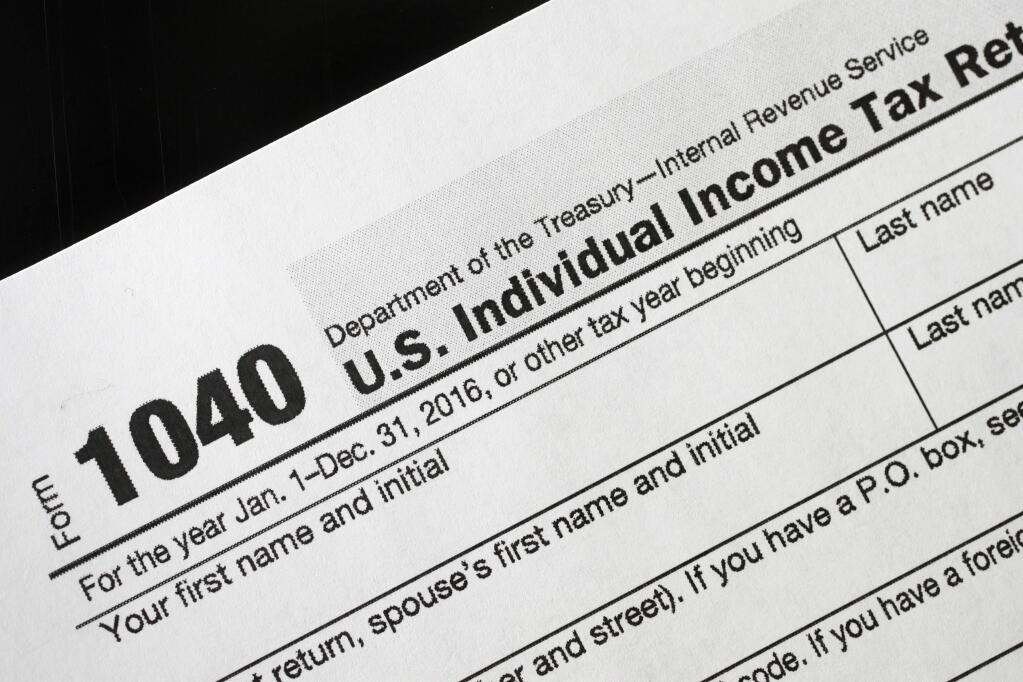 High-income California taxpayers would benefit if Congress relaxes or repeals a limit on itemized tax deductions. (MARK LENNIHAN / Associated Press)