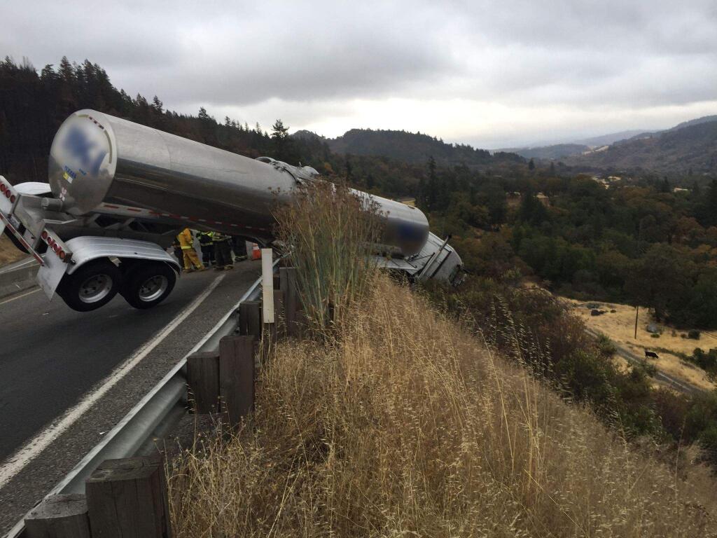 An empty tanker truck ended up over the guardrail just south of Willits on Highway 101, Thursday, Oct. 19, 2017. (CALFIRE DISTRICT 1)