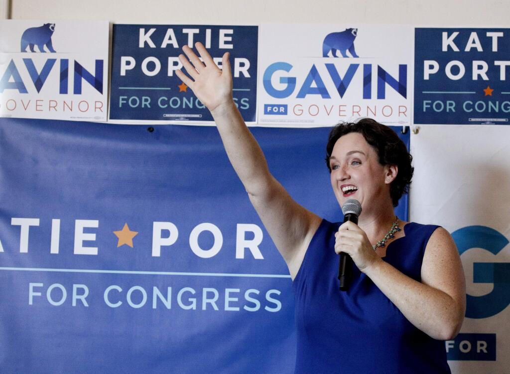 In this Saturday, Sept. 15, 2018, photo, Katie Porter, candidate seeking election to the U.S. House to represent the 45th Congressional District of California arrives for a campaign event in Tustin, Calif. California Rep. Mimi Walters continued support of the tax overhaul sets up a stark choice in a district won by Democrat Hillary Clinton in the 2016 presidential race. Walters‚Äô opponent, Porter, is trying to make the tax changes a key part of her argument against the incumbent. (AP Photo/Chris Carlson)