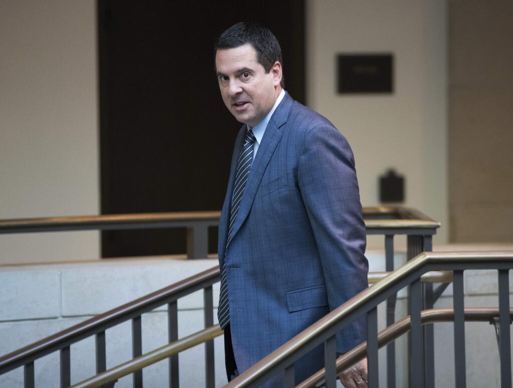 FILE - In this Feb. 27, 2018 file photo, House Intelligence Committee Chairman Devin Nunes, R-Calif., a close ally of President Donald Trump, arrives at the Capitol in Washington. Nunes is suing Twitter and several of its users for more than $250 million, accusing them of defamation and negligence. The suit filed Monday, March 18, 2019, in Virginia accuses Twitter of 'knowingly hosting and monetizing content that is clearly abusive, hateful and defamatory.' (AP Photo/J. Scott Applewhite, File)