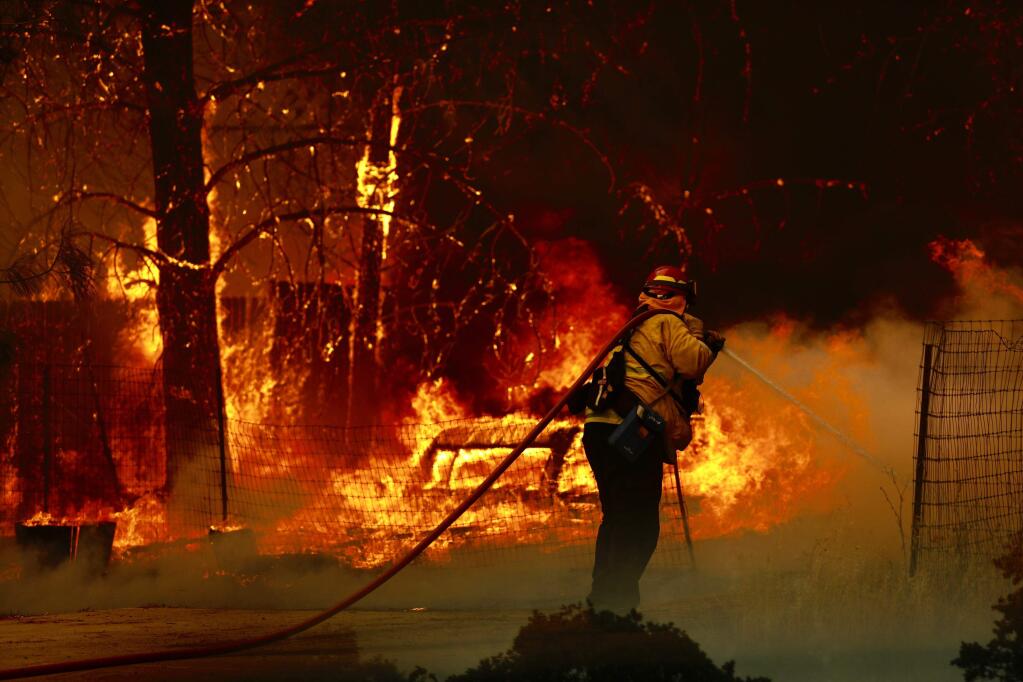 A firefighter battles the Pawnee fire in Lake County on Sunday, June 24, 2018. (BETH SCHLANKER/PRESS DEMOCRAT)