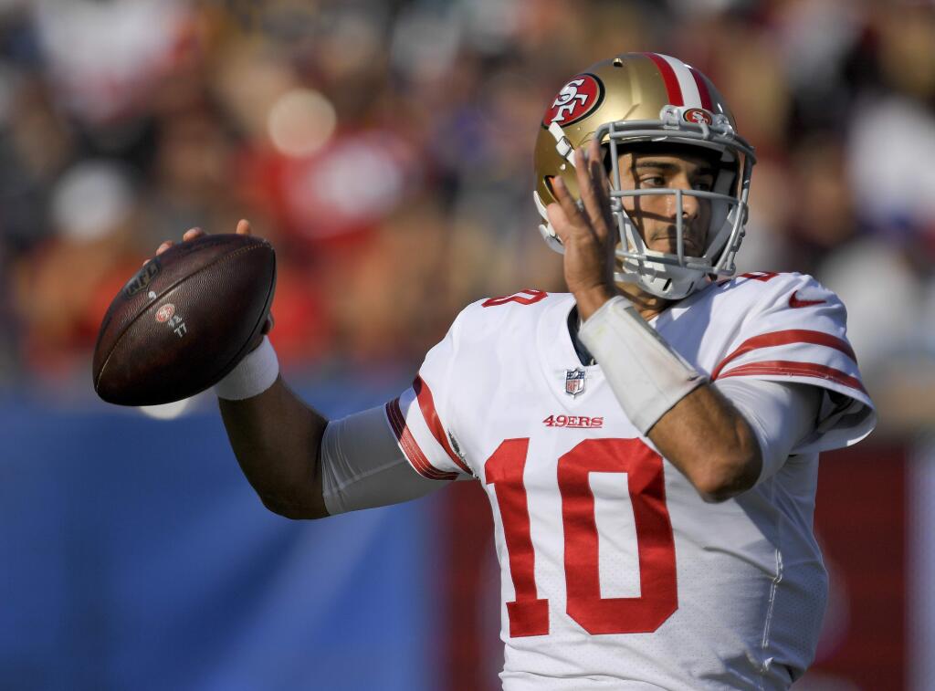 San Francisco 49ers quarterback Jimmy Garoppolo passes against the Los Angeles Rams during the first half Sunday, Dec. 31, 2017, in Los Angeles. (AP Photo/Mark J. Terrill)