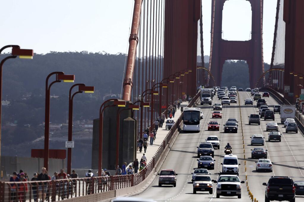 Motorists, pedestrians, and cyclists traverse the Golden Gate Bridge in 2014. (BETH SCHLANKER/ PD FILE)