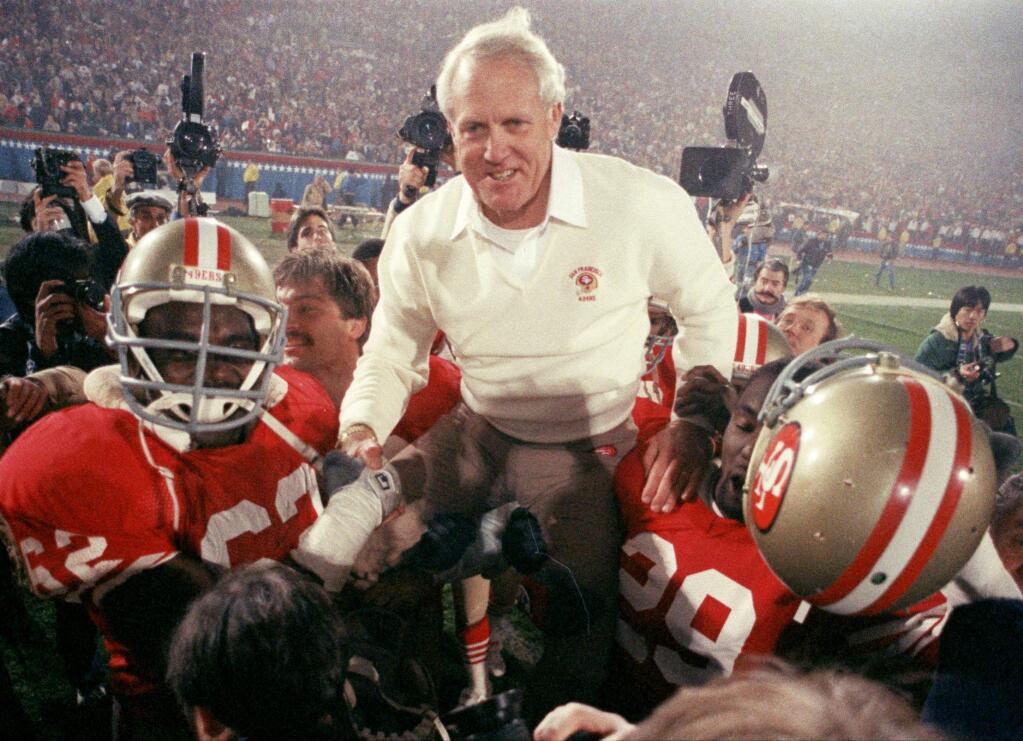 San Francisco 49ers coach Bill Walsh is hoisted on the shoulders of his team after they defeated the Miami Dolphins 38-16 in Super Bowl XIX in this Jan. 20, 1985 file photo, at Stanford Stadium in Palo Alto.