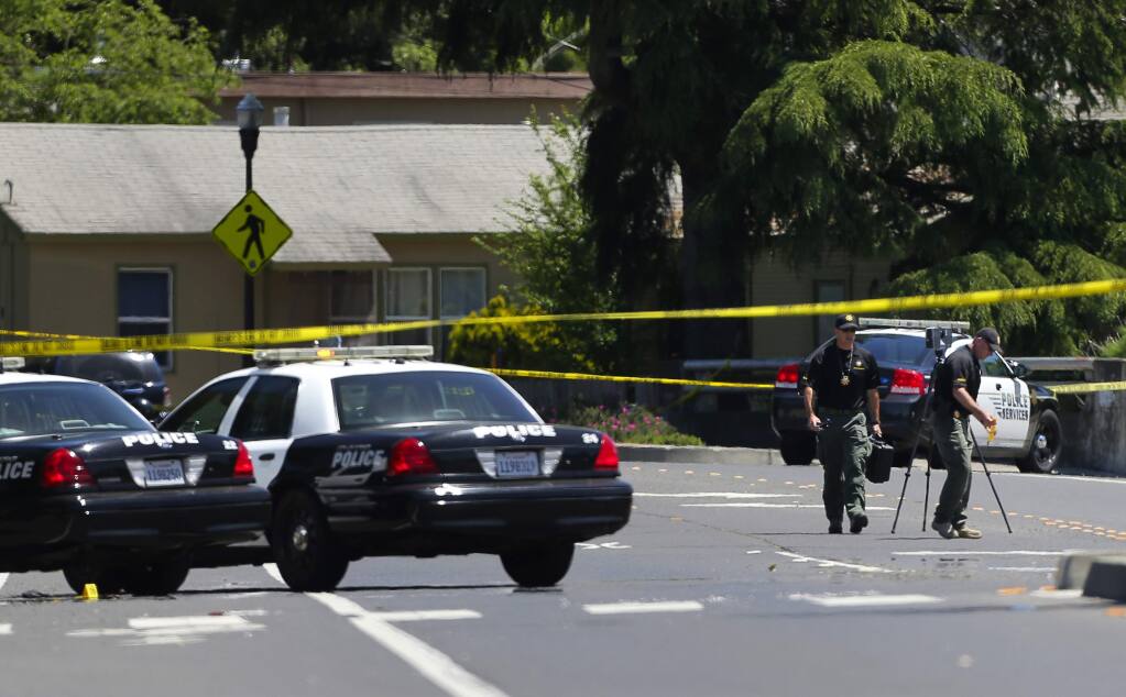 Sonoma County Sheriff's Office personnel gather evidence tied to a shooting investigation, along East Cotati Avenue in Cotati on Friday, May 5, 2017. (CHRISTOPHER CHUNG/ PD)