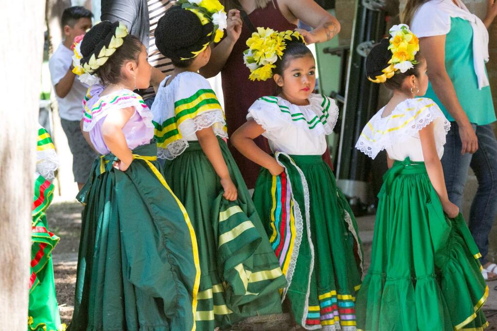 Dancers from Sonoma's Ballet Folklorico Quetzalen wait to take the stage in the Sonoma Plaza during the Cinco de Mayo celebration Sunday, May 1, 2016. (Photo by Julie Vader/Special to the Index-Tribune)