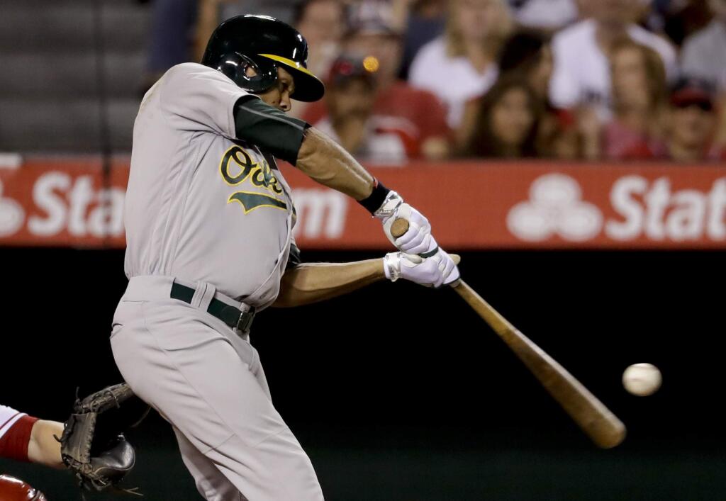 The Oakland Athletics' Coco Crisp hits a home run against the Los Angeles Angels during the fifth inning in Anaheim, Calif., Tuesday, Aug. 2, 2016. (AP Photo/Chris Carlson)