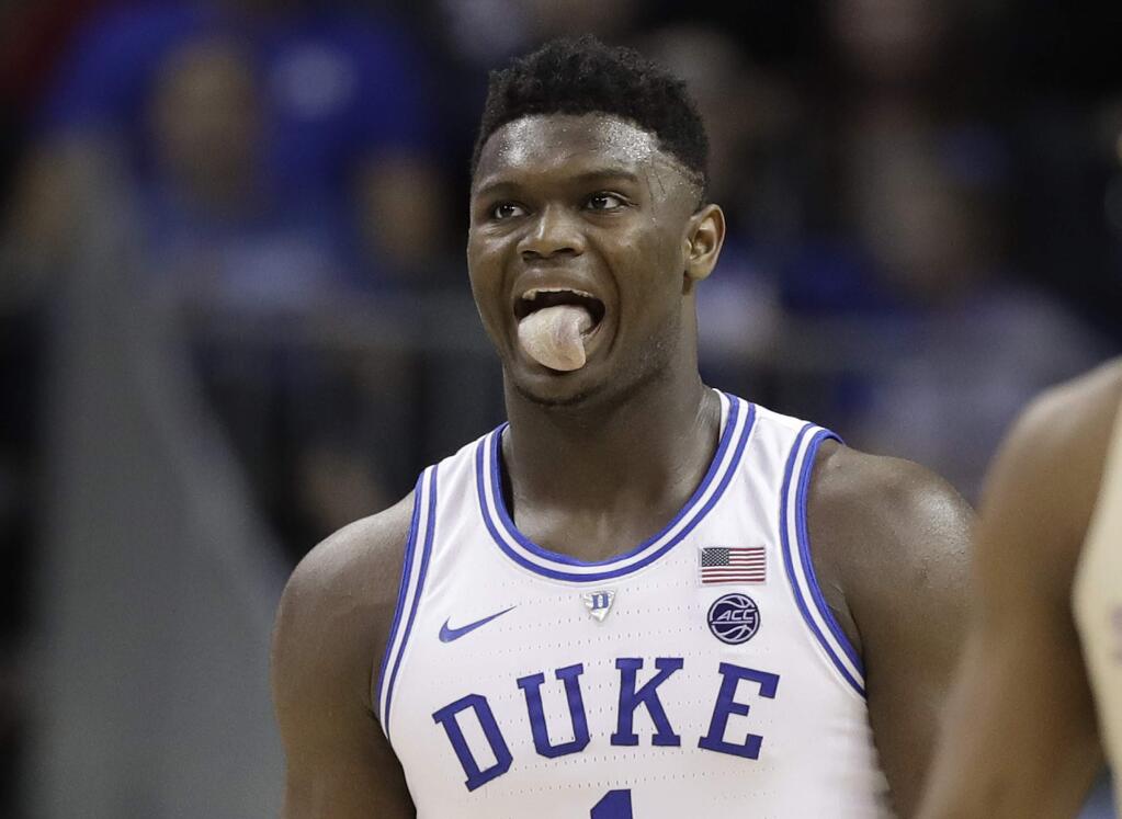 Duke's Zion Williamson (1) reacts during the second half against Florida State in the NCAA college basketball championship game of the Atlantic Coast Conference tournament in Charlotte, N.C., Saturday, March 16, 2019. (AP Photo/Chuck Burton)