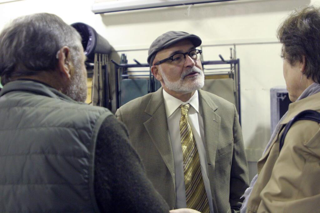 Jerry Threet, director of the county's new Independent Office of Law Enforcement Review and Outreach, talks with some El Verano residents at a community meeting on Dec. 8, 2016. (Christian Kallen/Index-Tribune)