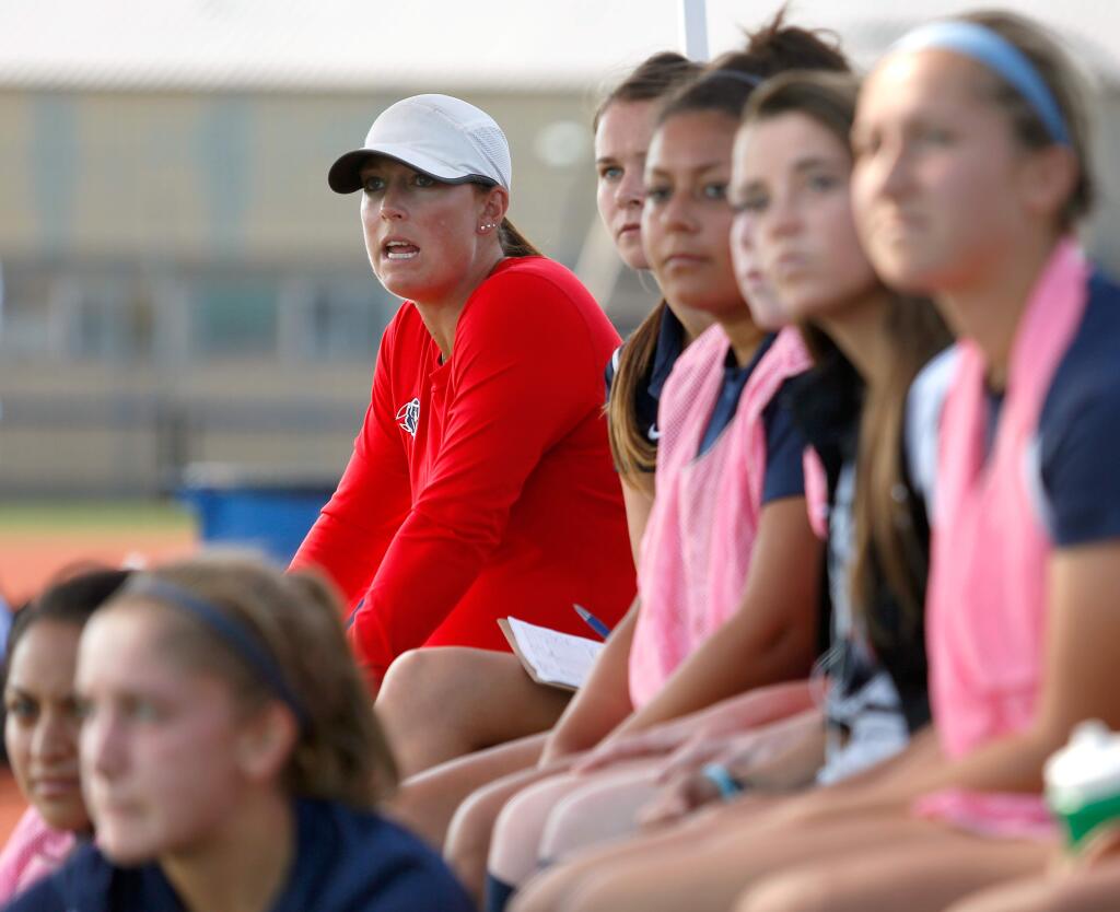 Bear Cubs women's soccer head coach Crystal Howard, in red, gives instructions to her players during a match against Modesto Junior College at SRJC in Santa Rosa on Friday, Oct. 16, 2015. (Alvin Jornada / The Press Democrat)