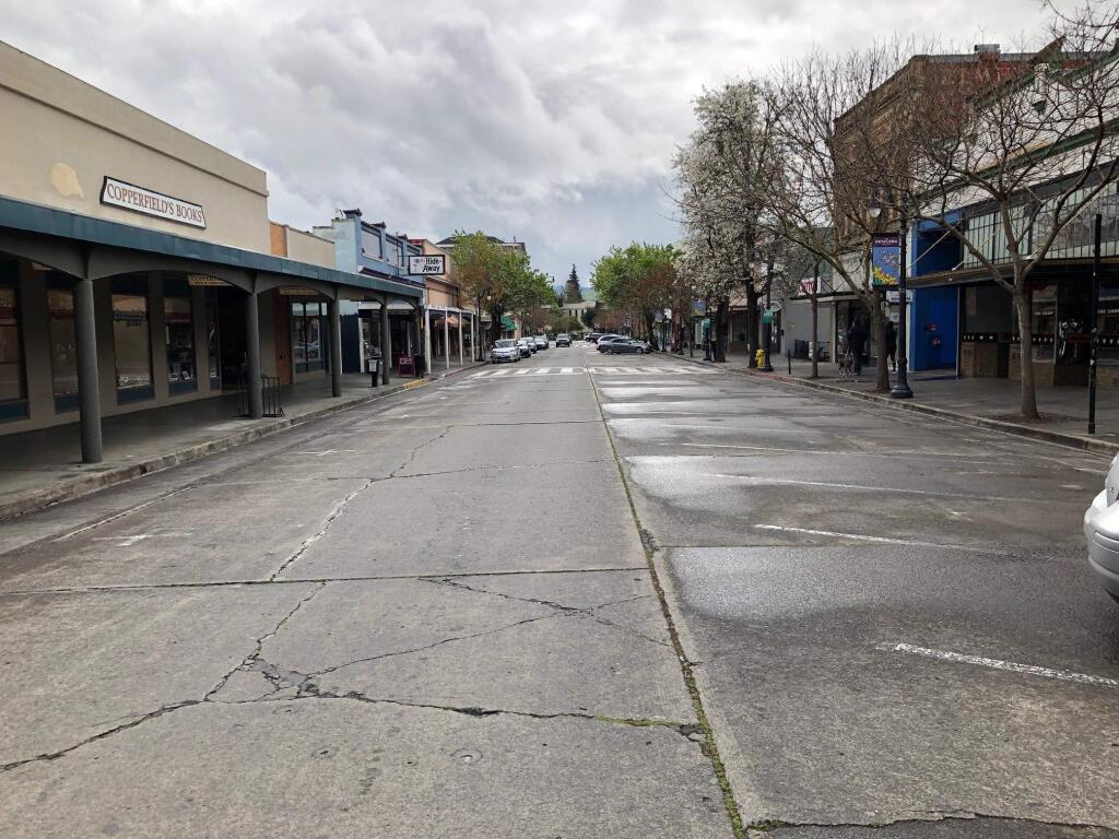 Most of the parking spaces are empty in downtown Petaluma on March 18, the first day of a countywide shelter in place order. MATT BROWN/ARGUS-COURIER STAFF