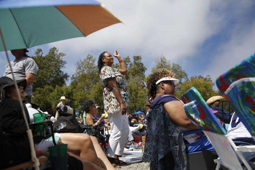 Sandra Johnson dances to music by Goapele at the Russian River Jazz and Blues Festival at Johnson's Beach on Saturday, September 20, 2014 in Guerneville, California. (BETH SCHLANKER/ The Press Democrat)