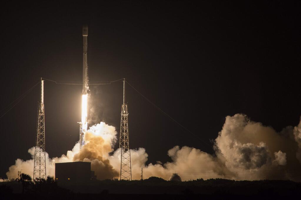 SpaceX's Falcon 9 rocket launches the JCSAT-14 communications satellite at Cape Canaveral, Fla, early Friday, May 6, 2016. The Falcon 9 first stage also landed on a droneship while the second stage continued on, delivering the spacecraft to a Geosynchronous Transfer Orbit. (SpaceX via AP)