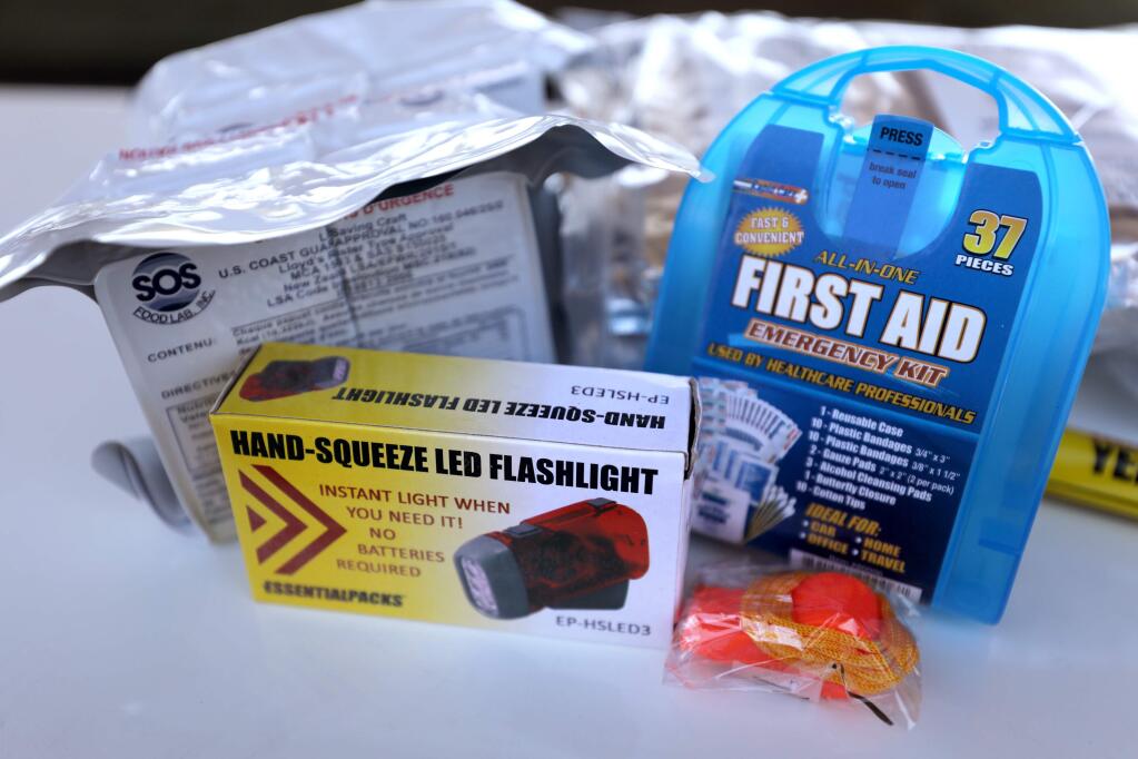 The contents of an emergency kit given away for free during the Sonoma Ready Day event at the Sonoma County Fairgrounds in Santa Rosa on Sunday, Sept. 8, 2019. (BETH SCHLANKER/ The Press Democrat)