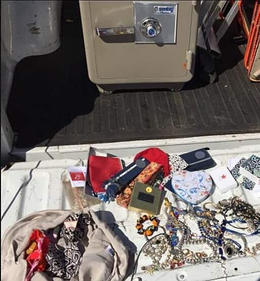Sonoma Sheriff's deputies display the safe, jewelry and other items apprehended on July 19, 2017, when three men were arrested for burglarizing a 96-year-old Sonoma woman. (SCSO)