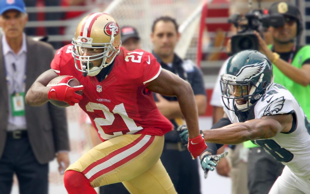 Frank Gore slips the tackle of Earl Wolff for a 55-yard touchdown reception in the 2nd quarter. The 49ers beat the Eagles, 26-21, at Levi Stadium on Sunday, Sept. 28, 2014.