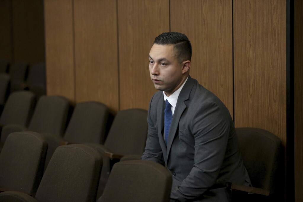 In this Sept. 30, 2016, photo, Contra Costa Sheriff's deputy Ricardo Perez waits for an arraignment hearing to begin in court at the Hayward Hall of Justice in Hayward, Calif. Authorities say Perez, a former San Francisco Bay Area sheriff's deputy, faces an additional sex charge for his alleged involvement in a wide-ranging police sex scandal involving a teenager. The East Bay Times reported that the Alameda County District Attorney's office filed the felony unlawful sex with a minor charge against Perez on Monday, Aug. 7, 2017. (Anda Chu/Bay Area News Group via AP)