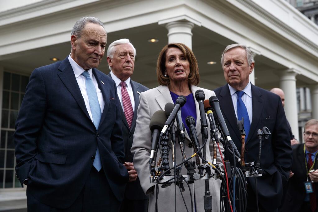 Speaker of the House Nancy Pelosi, D-Calif., speaks to reporters after meeting with President Donald Trump about border security in the Situation Room of the White House, Friday, Jan. 4, 2019, in Washington. From left, Senate Minority Leader Chuck Schumer, D-N.Y., House Majority Leader Steny Hoyer of Md., Pelosi, and Sen. Dick Durbin, D-Ill. (AP Photo/Evan Vucci)